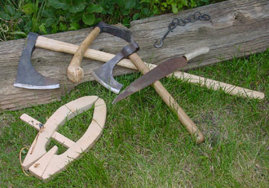Axes, a saw and a clamp